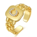Detailed view of a gold-plated letter C ring with shimmering rhinestones and chain strap band - Letter C
