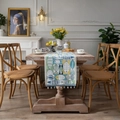 Green and blue jacquard table runner with fishbone patterns and fringe on wooden table - Green Little Fish With Beads