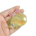 Close-up of disco ball earrings with pink glitter star studs and gold mirror finish - Gold