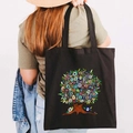 Black canvas tote bag featuring an artistic graffiti Greek Evil Eye tree print - Design M-Tree Art Eye-Black