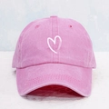 Close-up of pink washed cotton baseball cap featuring a white printed heart embroidery - One Size (57-59cm) / Pink