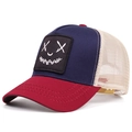 Detailed close-up of a tricolor mesh trucker hat featuring a smile face embroidery - Adjustable / Blue Red
