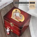 Detail of vintage wooden music box with heart window, cello decor, and ballerina - Brown Square Jewelry Box with Dancing Girl