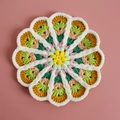 Handmade crochet flower coaster in colorful gradient with white fuzzy plush edging - No. 5 Gradient