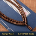 Chicken Wing Wood 108 prayer beads 8mm multilayer bracelet on vintage book background - Wenge Wood