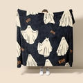 Detail of soft black flannel blanket with white ghost patterns and orange BOO text - Style 58 (Halloween Black Ghost Boo)