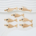 Set of seven gold fish bone pendants with black eye detail and hanging loops - Black Eye-YJ01-06