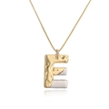 Two-tone gold and silver letter E pendant necklace on a delicate chain over white background - Letter E