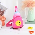 Detail of kids pink nylon chest bag with a yellow smiley face and adjustable strap - Smiley Face