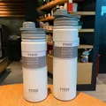 Detalle de botellas térmicas TYESO de acero inoxidable en tamaños 530ml y 750ml - 530ml / Blanco