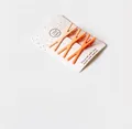Three-piece set of bright orange X-shaped matte hair clips on a white display card - D-059 Cross Style 3-Piece Set Orange