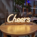 Detailed close-up of Cheers LED neon sign in acrylic box with warm white lighting - 3D Backboard Style / Warm White