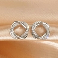 Elegant silver interlocking hoop earrings with cubic zirconia on champagne silk fabric - White Gold