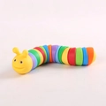 Rainbow-colored 3D articulated slug toy with a yellow cartoon face on white background - Yellow Caterpillar