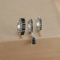 Macro shot of silver earring set featuring black zircon stones in a teardrop and rectangle design - Three-Piece Set / Silver-Black Zirconia
