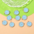 Detailed macro view of ten light blue enamel clock pendants with golden Roman numerals - Blue