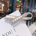 Elegant gold butterfly hair clip featuring white pearls and shimmering rhinestones - Silver Ribbon Pearl Clip