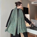 Detail of soft leopard print scarf in green draped elegantly in a cozy cafe setting - 17# Green Printed