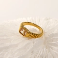 Close-up of a 18k gold plated ring featuring a large emerald-cut champagne zircon gemstone - Gold Champagne Zirconia