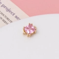 Macro shot of pink square zircon pendant with gold plated frame for DIY jewelry making - Pink