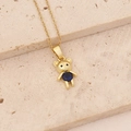 Detail of a golden bear necklace with a round blue gemstone on a textured stone base - Dark Blue Round Stone Bear (8#)