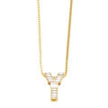 Macro shot of gold Y-shaped pendant necklace featuring square-cut zircon stones - Gold Y