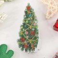 Festive Christmas tree hair claw clip with colorful ornaments on white marble background - Christmas Tree