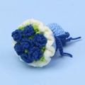 Handmade crochet blue flower keychain pendant with green leaves and white wavy edge details - Blue Yarn Hand Bouquet