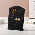 L-shaped black acrylic 72-hole earring display stand on marble surface for jewelry storage - Black