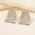 Detail of silver mesh woven earrings in 304 stainless steel with geometric trapezoid design - Woven Mesh Texture / Silver