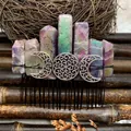 Macro shot of aura quartz hair comb with silver crescent moon detail and black metal pins - Amethyst Black Wire Silver Moon