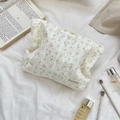 Close-up of floral makeup bag with lace detail and zipper on soft fabric background - Jacquard Yellow Cherry