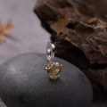 Macro shot of heart-cut yellow gemstone pendant with silver four-prong setting - Natural Citrine Heart Pendant Silver