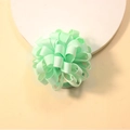 Detailed close-up of mint green curly grosgrain ribbon hair tie for kids accessories - Emerald Green