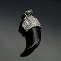 Detailed view of resin wolf tooth pendant with silver lion head stainless steel cap - Steel Black Tooth (No Chain)