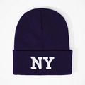 Close-up of white NY embroidery on dark purple knit beanie with ribbed texture - One Size / Navy Blue
