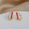 Detail of gold earrings with red enamel inlay and row of clear baguette zircon stones - Red Enamel/Baguette Zircon / Golden Red