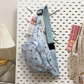 Light blue dachshund cartoon chest bag with adjustable strap on white pegboard - Light Blue