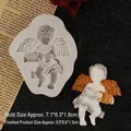 Silicone angel accordion mold with finished resin cast showing size 7.1x8.3x1.8cm - Gray