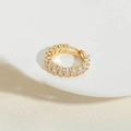 Detail showing gold eternity ring with oval claw-set cubic zirconia and adjustable opening - 14K Gold White Zirconia