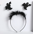 Detail of Halloween headband with black ostrich feathers and glitter ghost icons on springs - Black Feather White Ghost