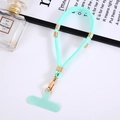 Close-up of mint green nylon phone lanyard with gold metal buckle on a white background - Lake Blue