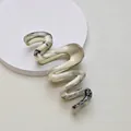Detailed view of the marble texture and wavy design on this elegant hair claw clip - 13cm Snake Wave / Black and White Marble