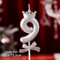 Silver number 9 birthday candle with a crown, bow detail, and pearl finish, 6cm size - Number Candle Silver Crown Bow 9