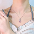 Detail of silver bunny necklace and ring set with pink stones on a model - Pink Zircon Rabbit Pendant (No Chain)