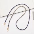 Detail of woven gold metal chain with navy blue leather strap and lobster clasps - Sapphire Blue