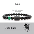 Detail of Leo zodiac bracelet featuring matte black agate beads and engraved symbol - Leo