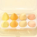 Detailed view of 8 soft non-latex makeup sponges in a clear storage organizer box - 8-Piece Set - Cheese Mango (Yellow Series)