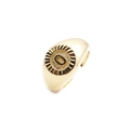 Macro shot of gold-plated signet ring with engraved letter O and sunburst texture - Letter O