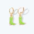 Detailed close-up of green enamel cowboy boot earrings with a golden star on white background - Hoop Earrings / Green